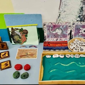 Small world activity tray with multiple play scenarios including water tray farm and building blocks at Innovative Early Learning